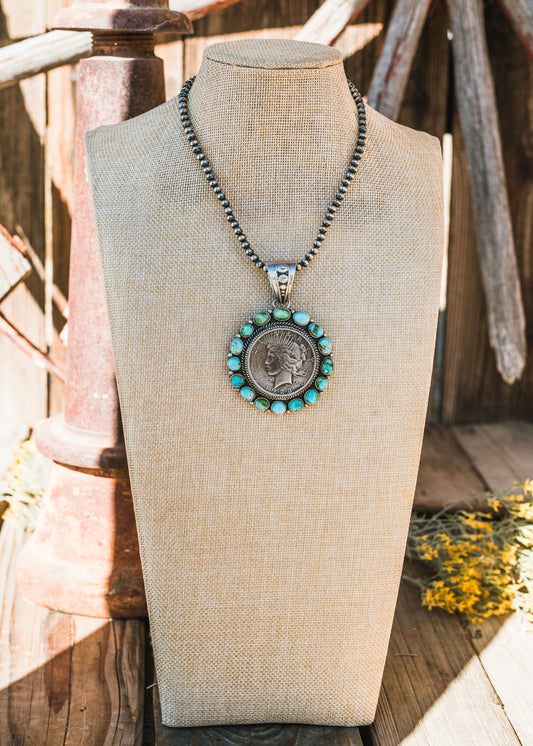 Sonora Gold Turquoise Peace Dollar Pendant set is Sterling Silver, Signed by Artist.