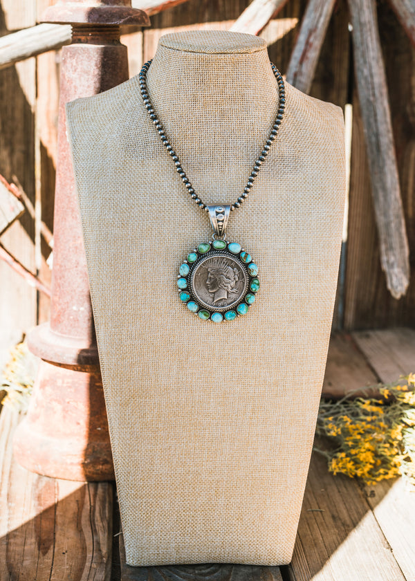 Sonora Gold Turquoise Peace Dollar Pendant set is Sterling Silver, Signed by Artist.